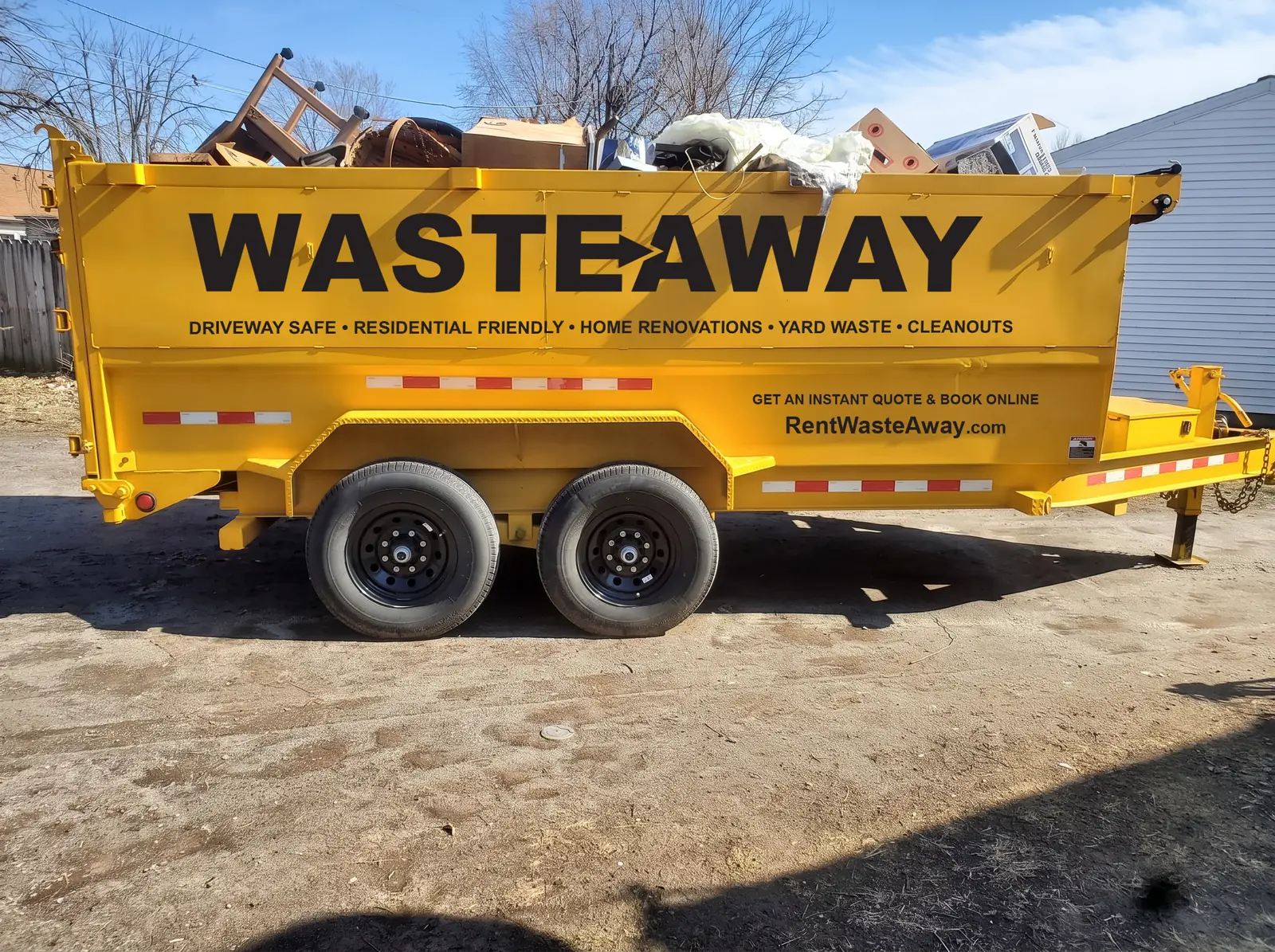 Waste Away 15-yard dumpster loaded with household cleanout debris